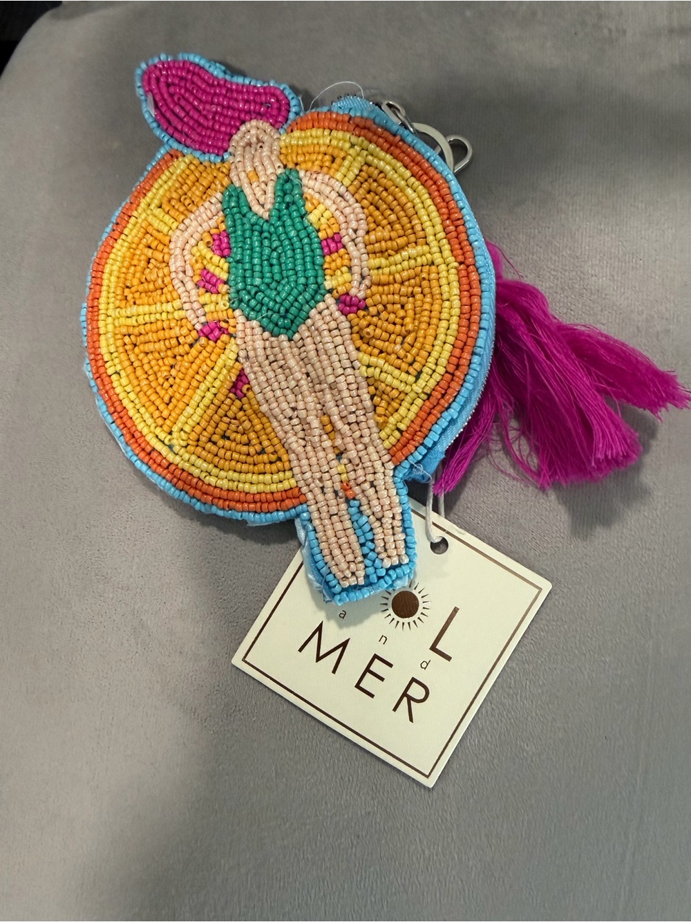 WOMAN ON POOL FLOAT BEADED COIN PURSE / PRICE IS FIRM